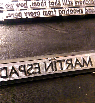 Martín's name cast in hot metal.